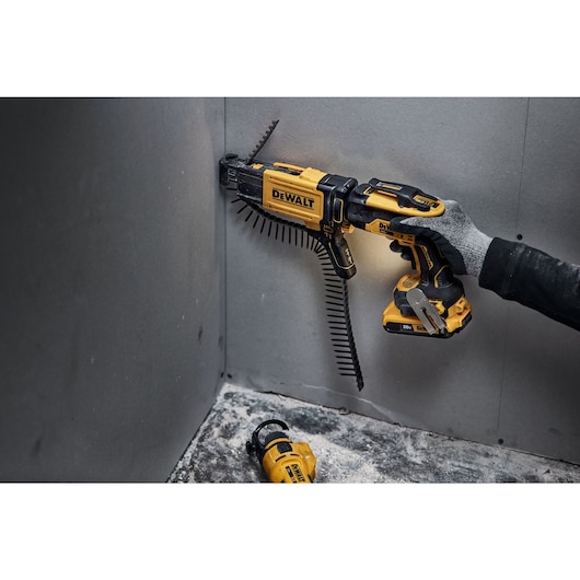 individual using a 20V MAX* XR® Brushless Drywall Screwgun in a tight corner